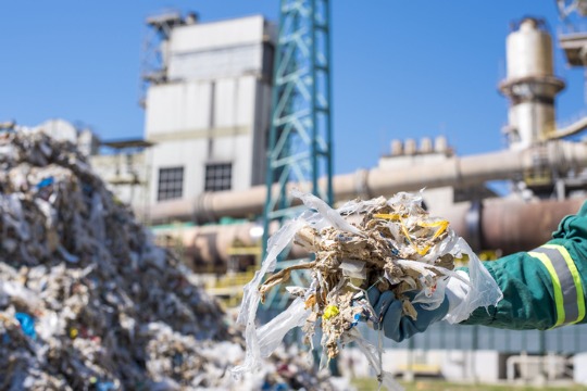 selective-focus-shot-of-a-person-wearing-gloves-holding-shredded-municipal-waste 540x360
